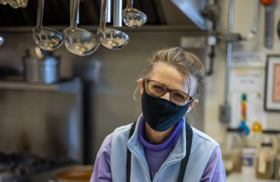 A staff member smiling