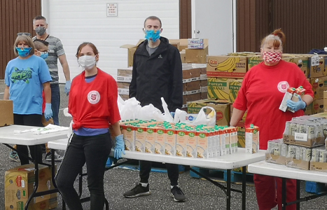 Food bank volunteers smiling