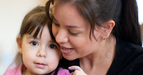 A mother nurturing her child