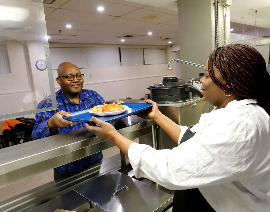 A client being served with hot food