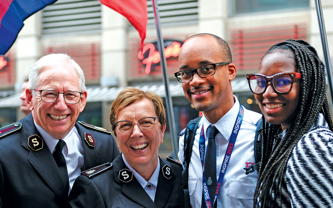 The Salvation Army leaders with other staff members smiling